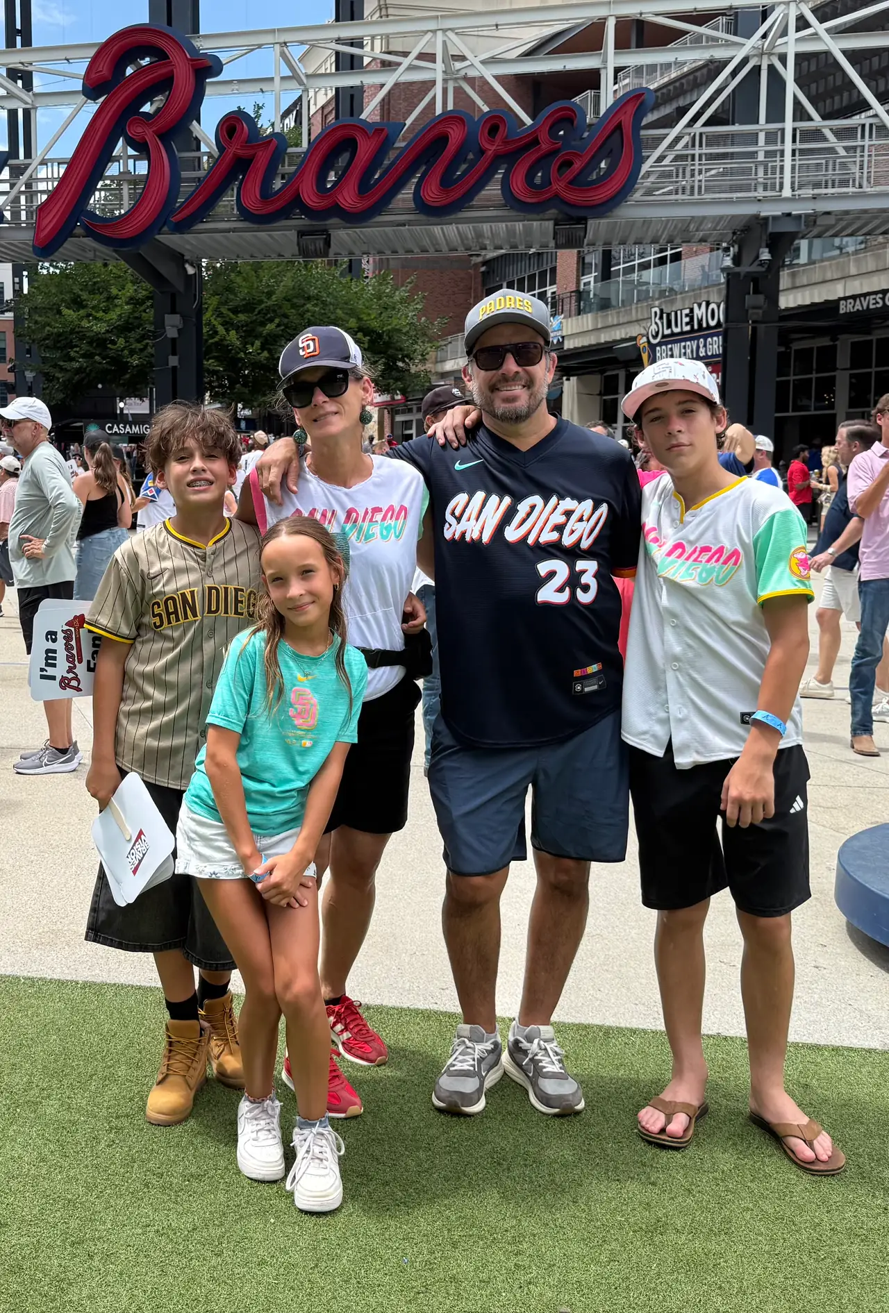 Cindy and Ernesto Espinoza with their three kids at the ballpark in Atlanta.